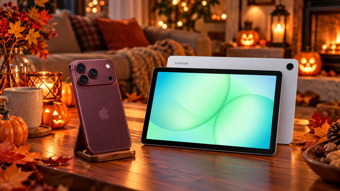 Apple iPhone 18 Pro 勃根地紅與 三星 Galaxy Tab A11+ 銀色平板擺放於木質桌面，搭配南瓜燈、楓葉與暖色燈光，營造溫馨秋季萬聖節氛圍。